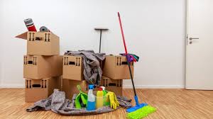 Moving boxes and cleaning supplies ready for a move-in clean